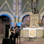 John Doan in Concert playing harp guitar in ancient church