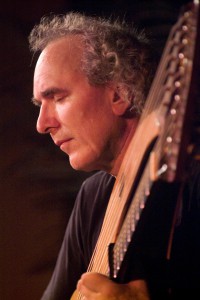 John Doan in concert with harp guitar closeup on stage Jenks Hall Portland Oregon