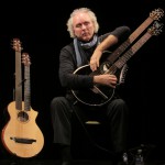 John Doan playing Brunner Harp Guitar on stage in concert