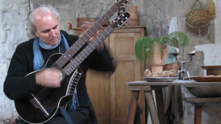 john doan playing harp guitar in England.