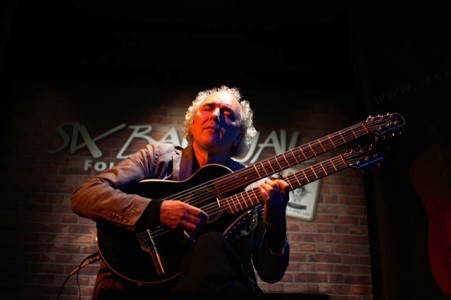 John Doan peforms at the Six Bar Jail with the harp guitar.