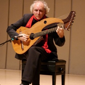 John Doan Xian China during concert playing harp guitar