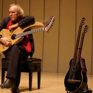 John Doan Xian China playing harp guitar on stage